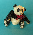 Black Panda Sitting